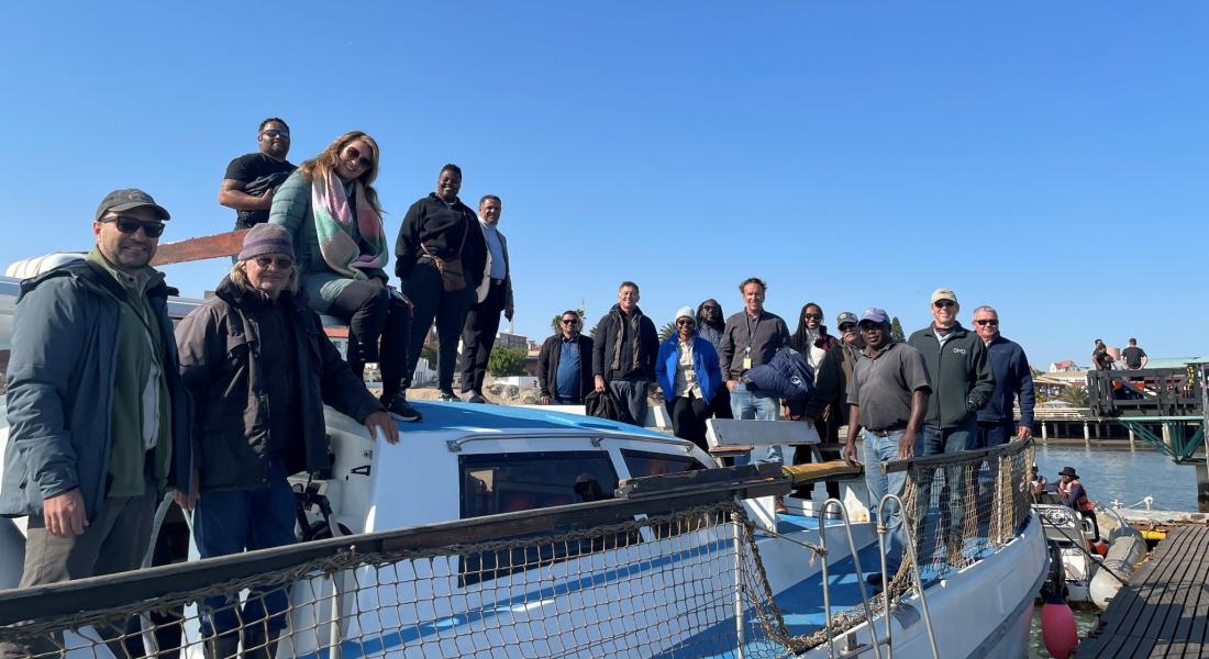 U.S. Ambassador Randy Berry, British High Commissioner Charles Moore return from Halifax island to the port of Luderitz with leaders from the Namibia Nature Foundation, NAMCOB, and conservation supporters.